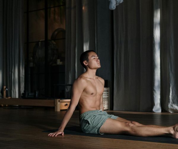 Man in a meditative state after a workout, showing mental focus.